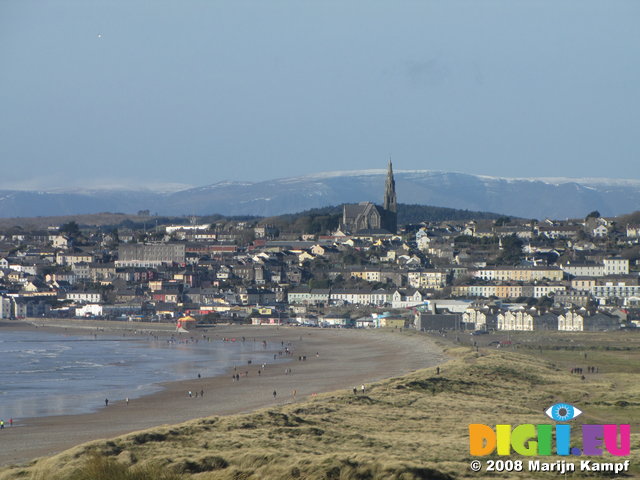 SX01610 Tramore beach with snowy Comeragh Mountains in background
